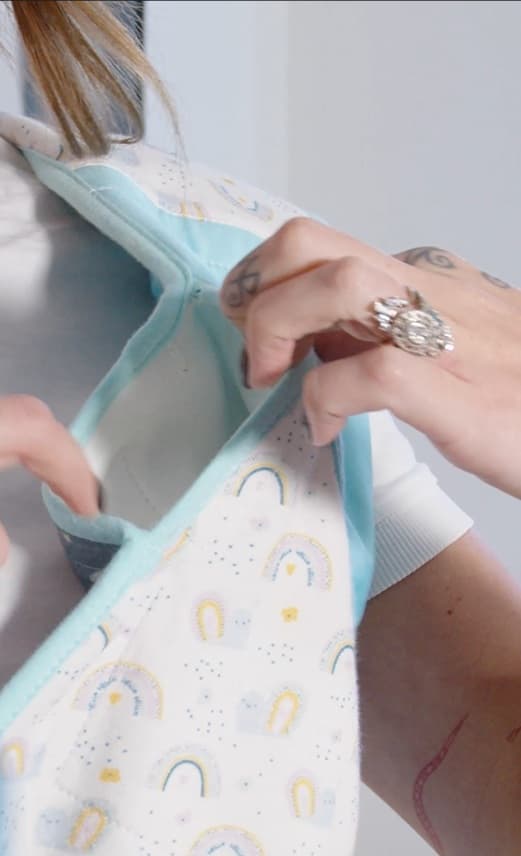 Opening the Cool Cuddle to reach the cooling pocket