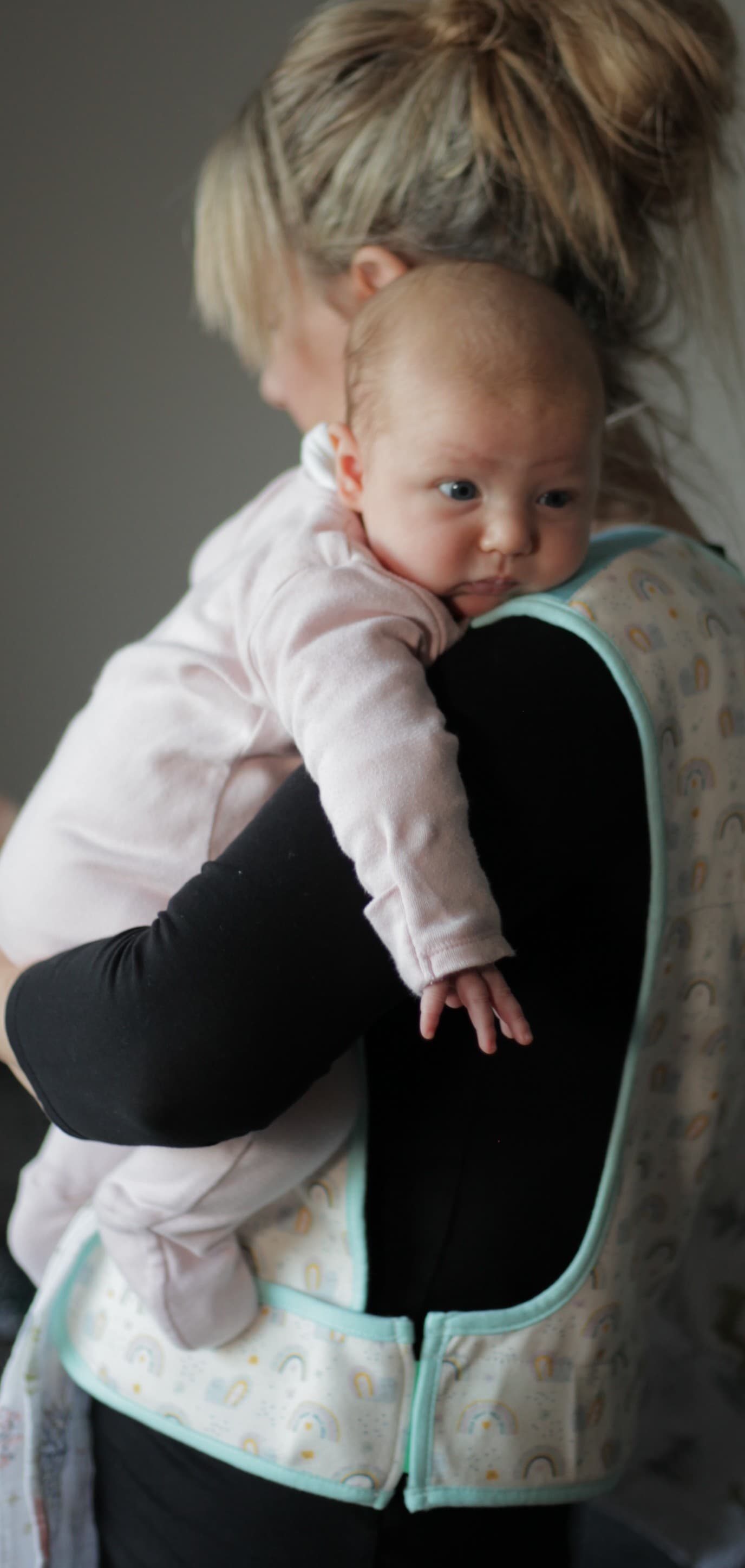 New parent caring for baby with essential baby health supplies
