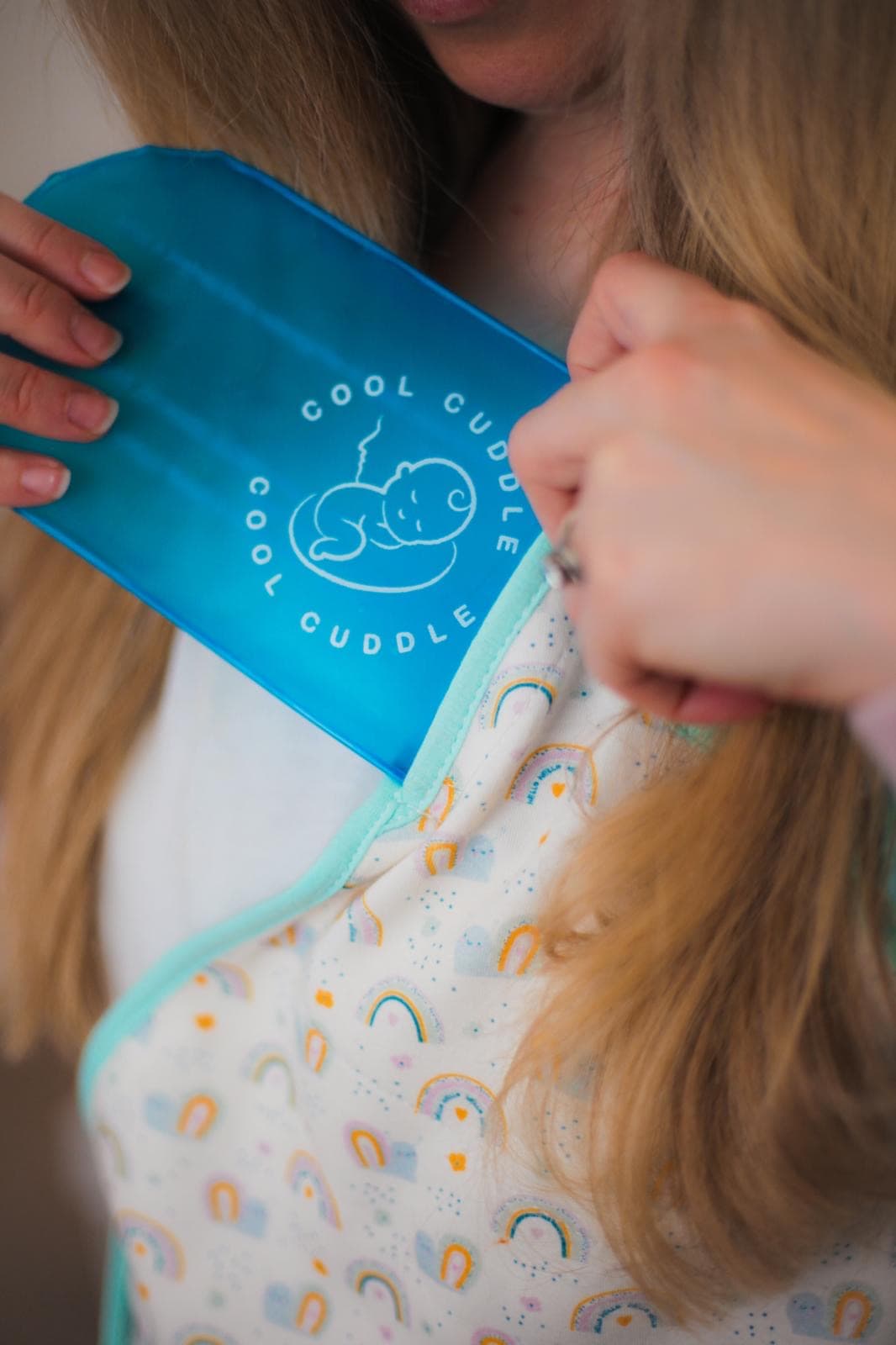Inserting the Cool Cuddle cooling gel pack into the vest pocket